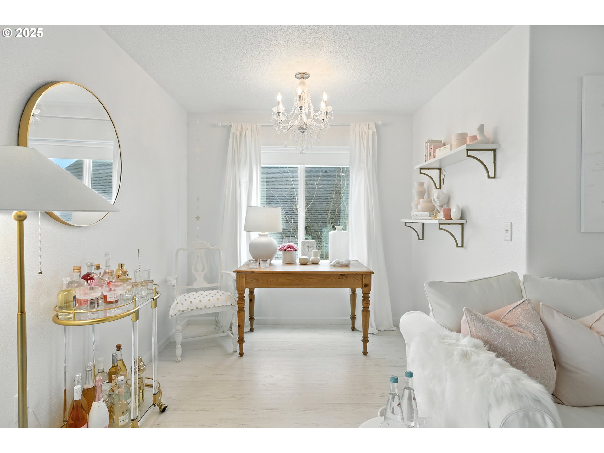 2210 South White Salmon Drive Ridgefield, WA 98642 - Photo 33 of 45 a living room with furniture and a chandelier