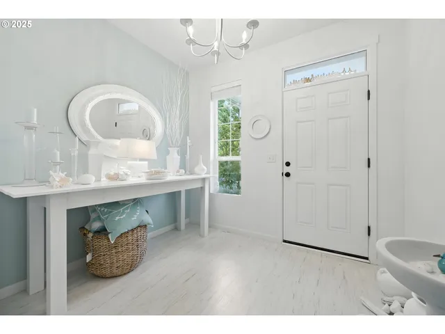 a room with round mirror and window