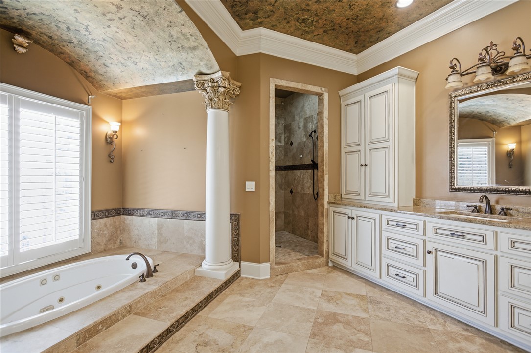 610 Highridge Drive Seneca, SC 29672 - Photo 30 of 50 This spacious primary bathroom features elegant architectural details and a soothing color palette.
