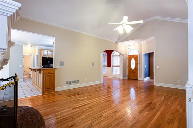 a bathroom with a granite countertop toilet and a sink