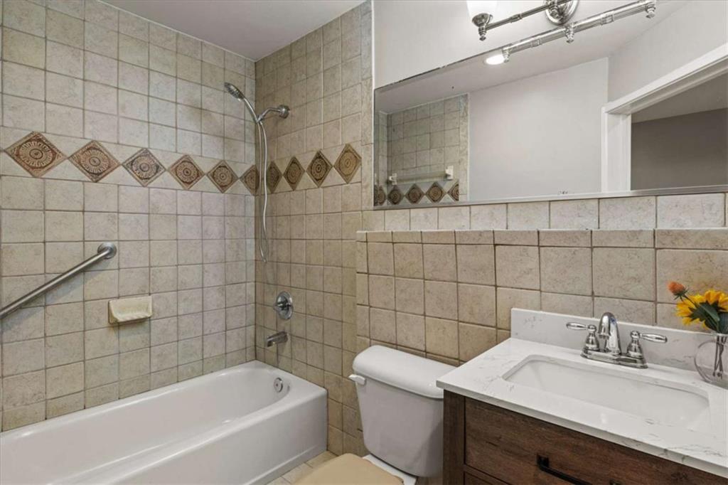 2115 Julien Overlook, Unit 2 Conyers, GA 30012 - Photo 11 of 13 a bathroom with a sink mirror toilet shower and bathtub