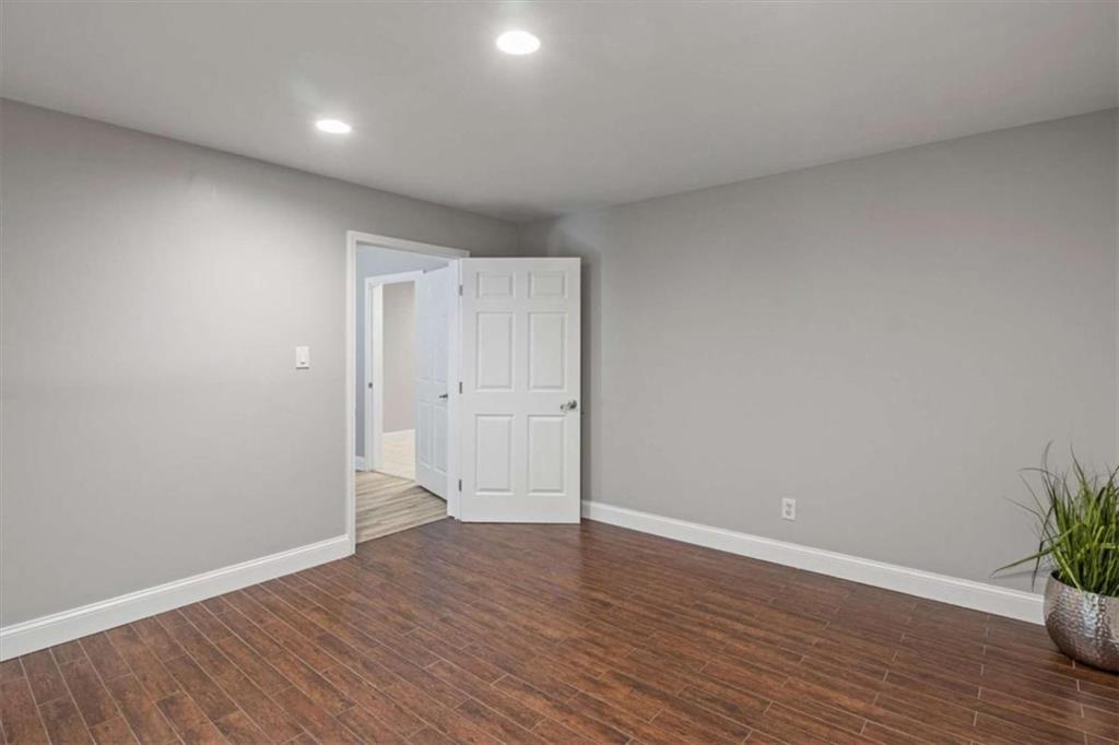 2115 Julien Overlook, Unit 2 Conyers, GA 30012 - Photo 6 of 13 a view of an empty room with wooden floor