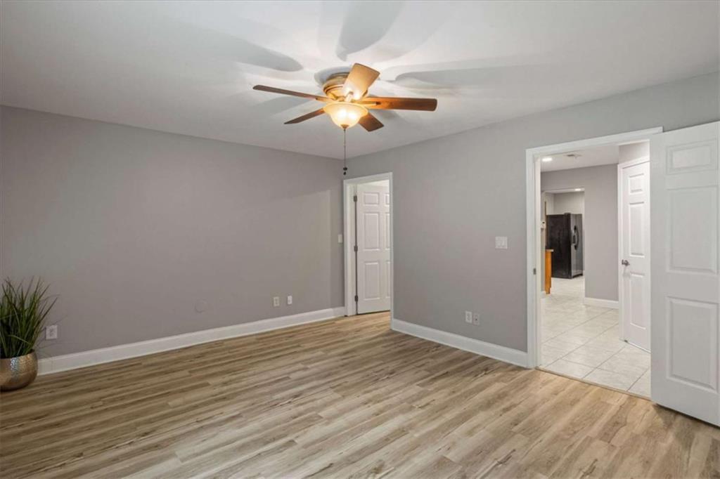 2115 Julien Overlook, Unit 2 Conyers, GA 30012 - Photo 8 of 13 a view of a livingroom with a chandelier fan