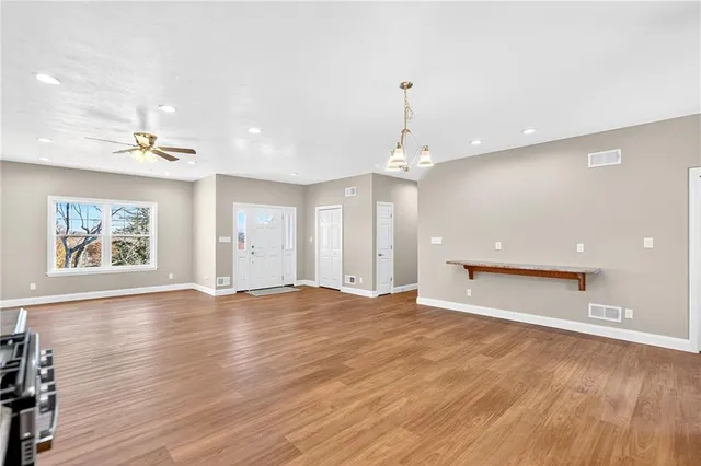 a view of a kitchen with a sink and a stove top oven