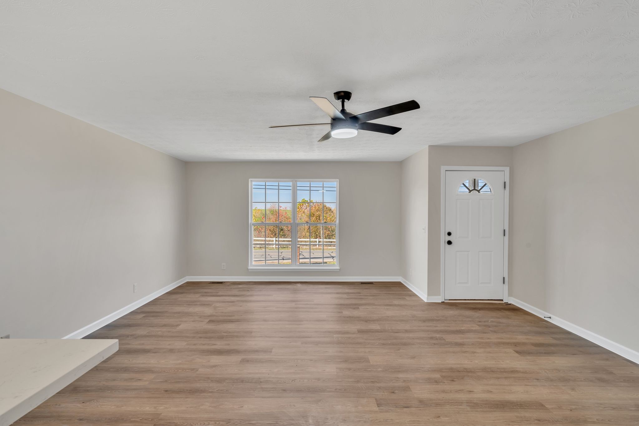 2338 South Main Street Springfield, TN 37172 - Photo 11 of 30 a view of an empty room with wooden floor and a window