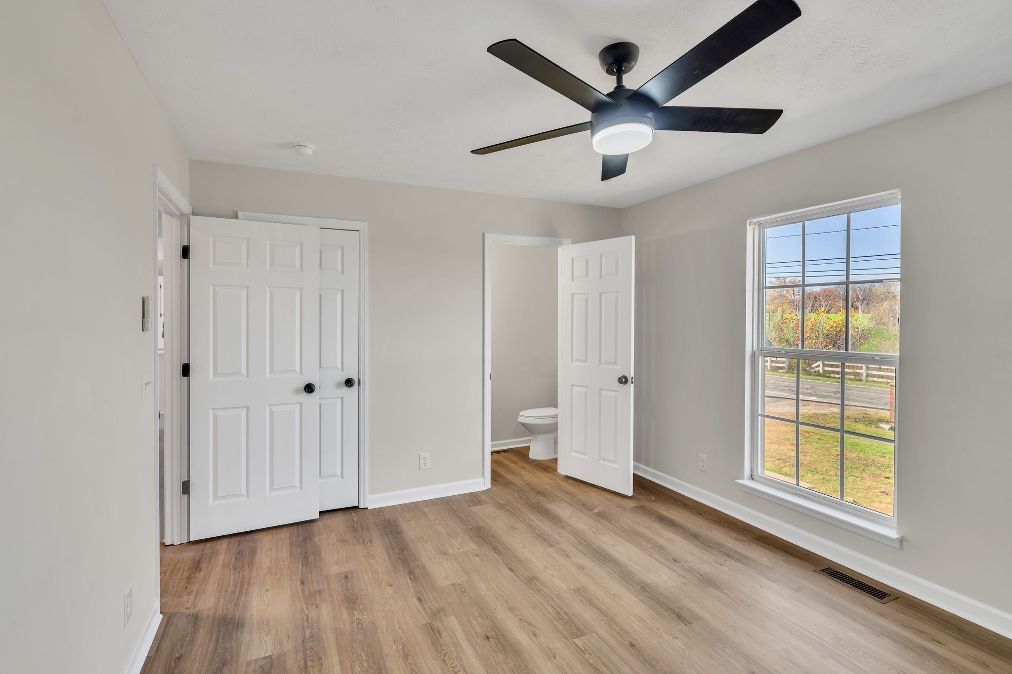 2338 South Main Street Springfield, TN 37172 - Photo 14 of 30 a view of an empty room with a window and wooden floor