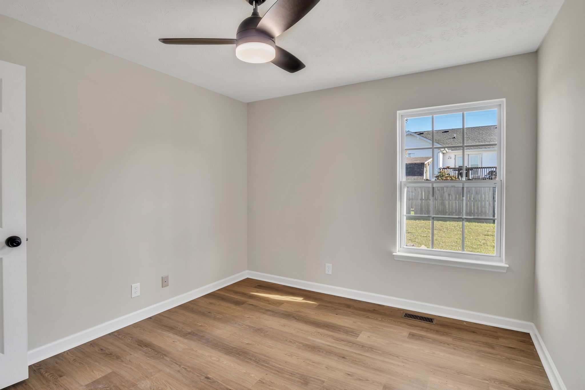 2338 South Main Street Springfield, TN 37172 - Photo 17 of 30 an empty room with a window and a ceiling fan