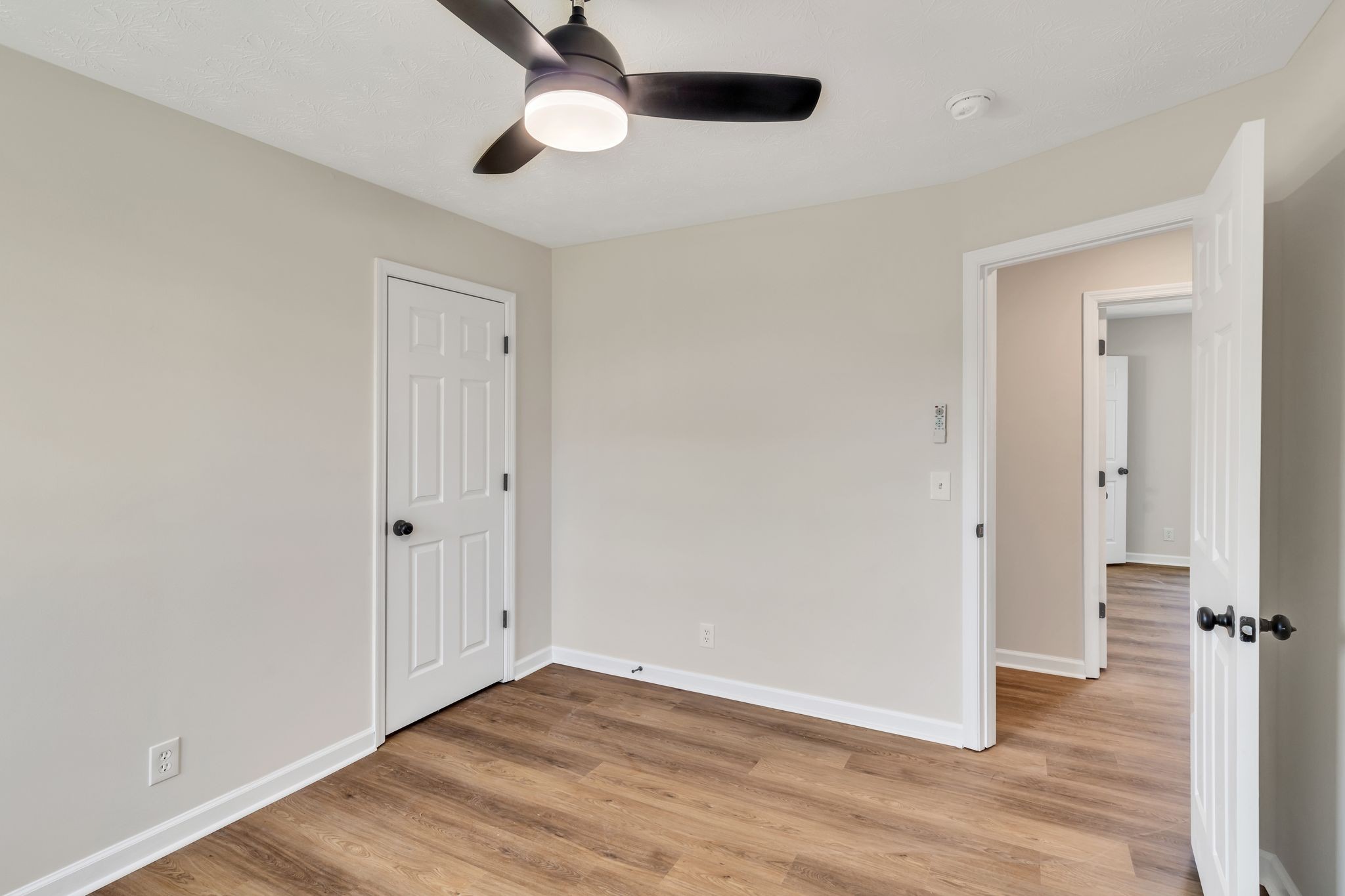 2338 South Main Street Springfield, TN 37172 - Photo 19 of 30 an empty room with wooden floor and windows