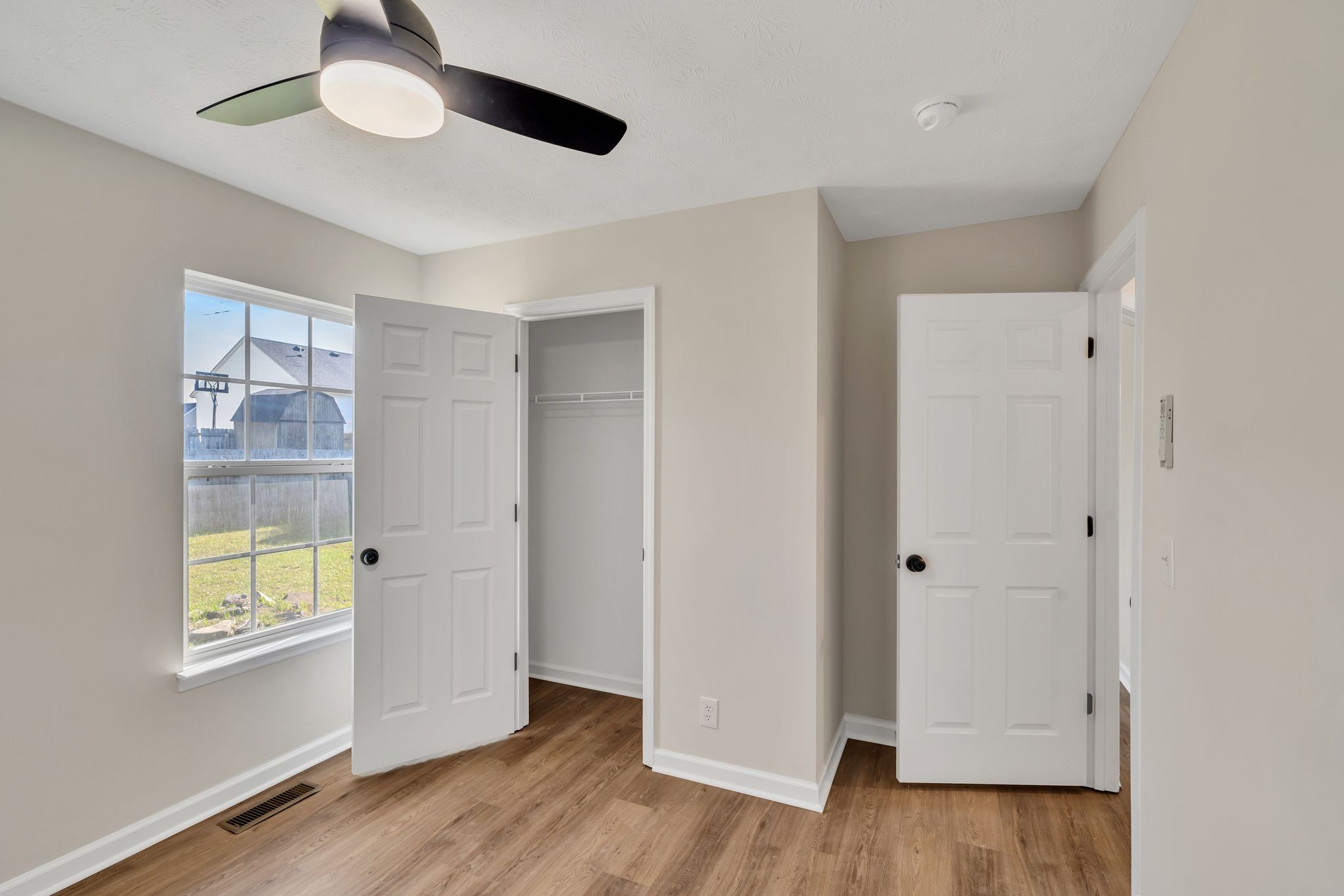 2338 South Main Street Springfield, TN 37172 - Photo 22 of 30 a view of empty room with wooden floor and fan