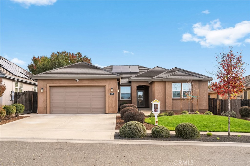 1971 Potter Road Chico, CA 95928 - Photo 1 of 59 a front view of a house with a yard and garage