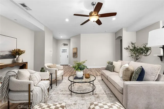a living room with furniture and a fireplace