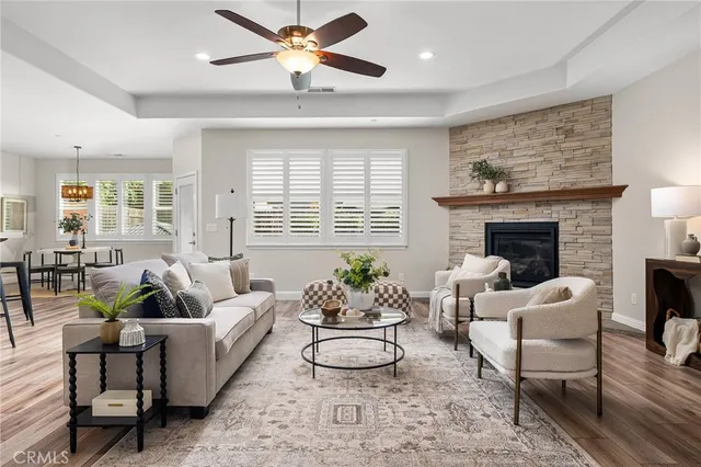 a kitchen with stainless steel appliances granite countertop a table chairs microwave and sink