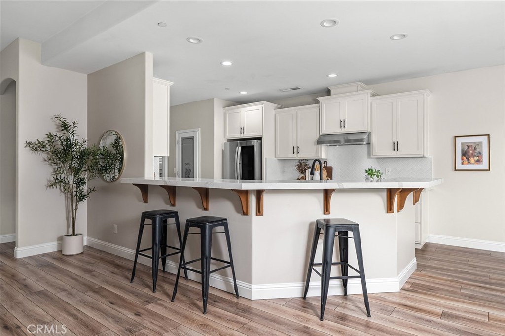 1971 Potter Road Chico, CA 95928 - Photo 18 of 59 a kitchen with stainless steel appliances granite countertop a table chairs microwave and sink