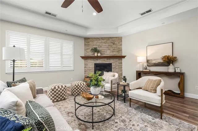 a living room with furniture and a fireplace