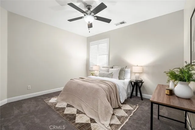 a bed room with a bed and a window