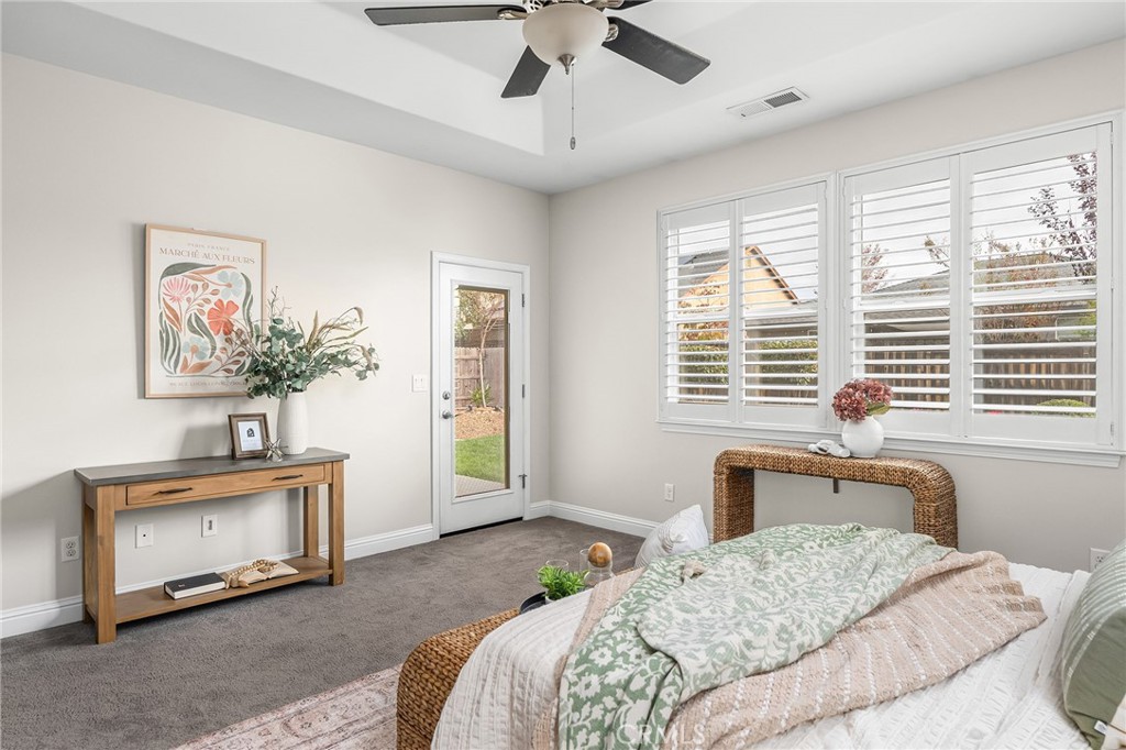 1971 Potter Road Chico, CA 95928 - Photo 36 of 59 a bedroom with a bed and a chandelier