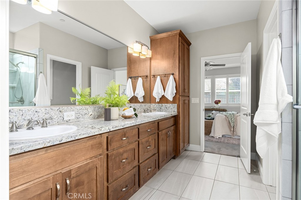 1971 Potter Road Chico, CA 95928 - Photo 40 of 59 a spacious bathroom with a granite countertop sink mirror and a