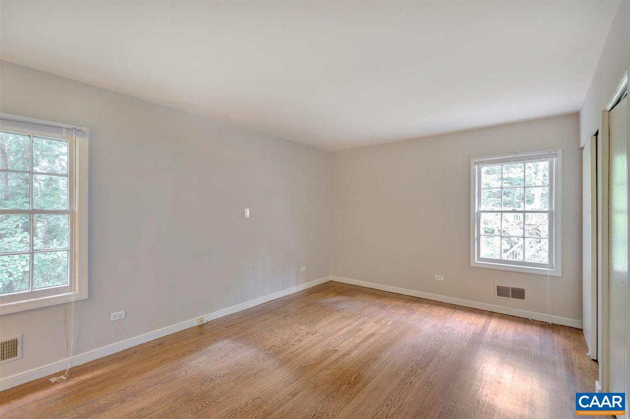 1522 Trailridge Road Charlottesville, VA 22903 - Photo 11 of 22 an empty room with wooden floor and windows