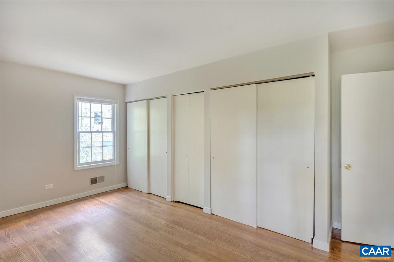 1522 Trailridge Road Charlottesville, VA 22903 - Photo 12 of 22 an empty room with wooden floor and windows