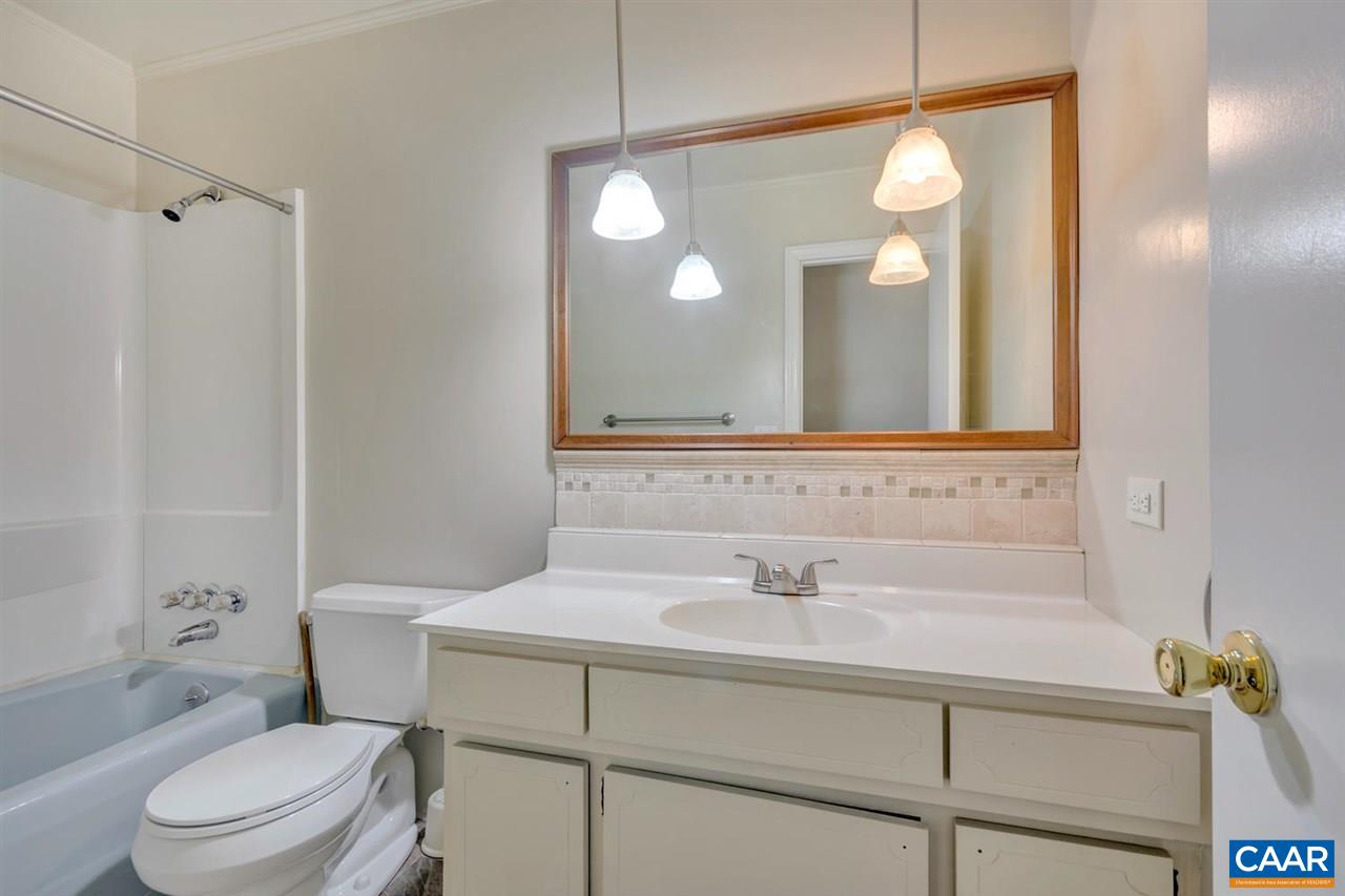 1522 Trailridge Road Charlottesville, VA 22903 - Photo 16 of 22 a bathroom with a sink mirror vanity and toilet