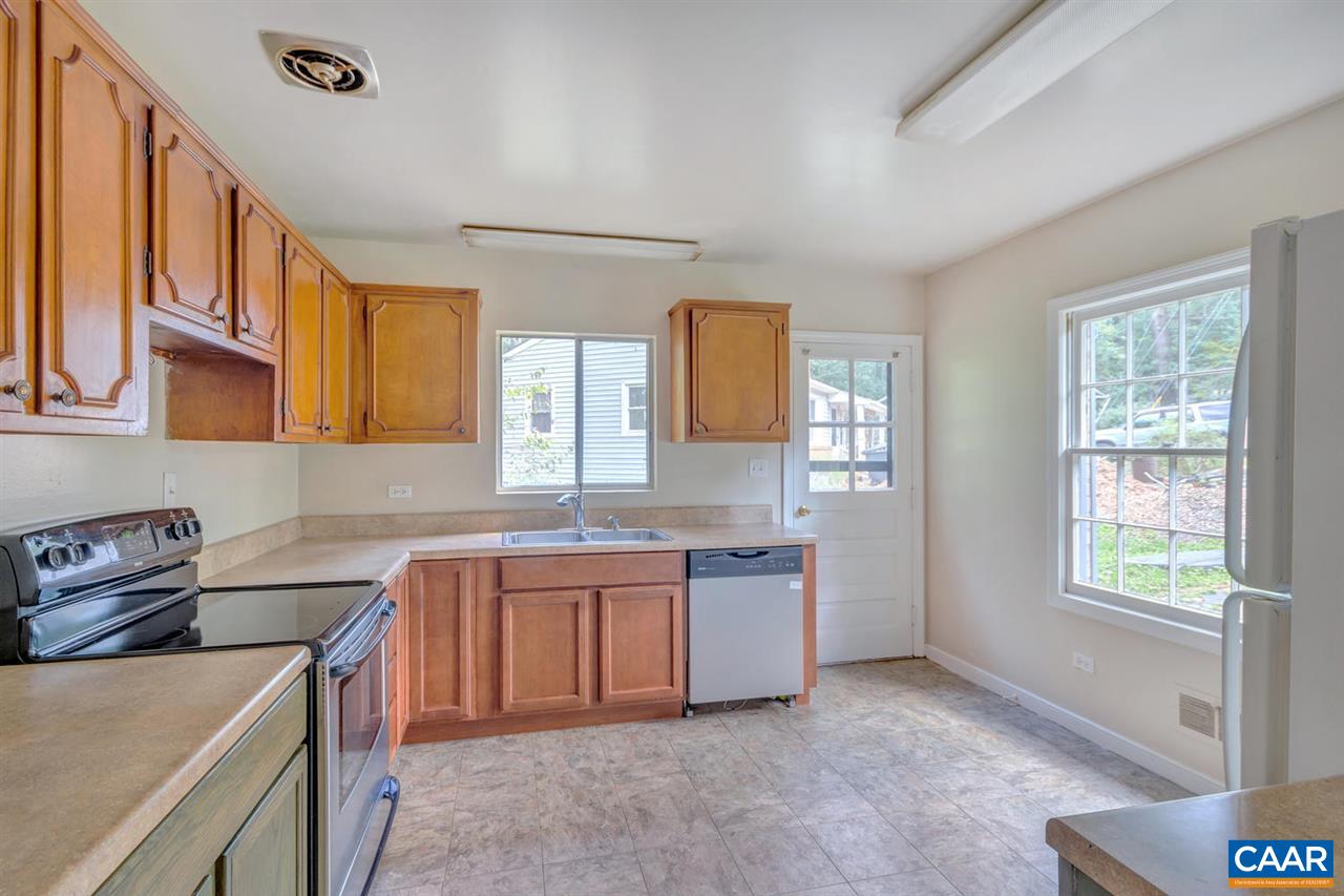 1522 Trailridge Road Charlottesville, VA 22903 - Photo 8 of 22 a kitchen that has a sink and a stove in it