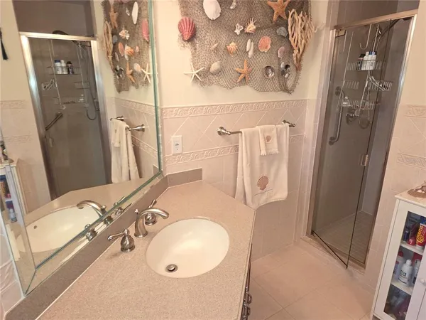 a bathroom with a sink and mirror