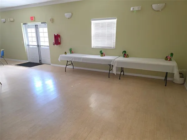 a kitchen with sink and cabinets