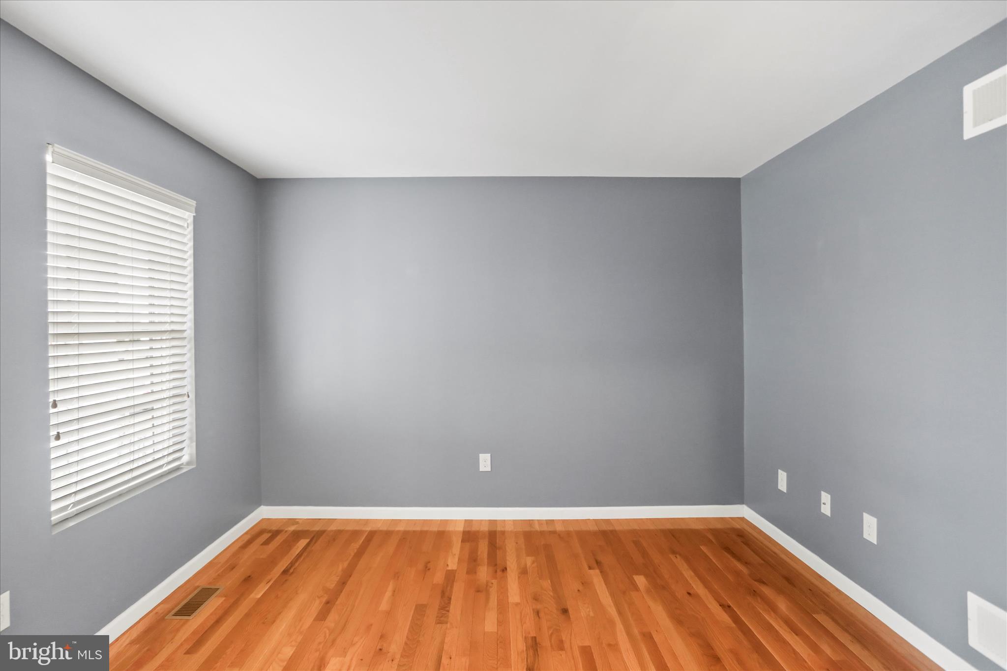 26 South 3rd Street New Freedom, PA 17349 - Photo 15 of 64 a view of room with window and wooden floor