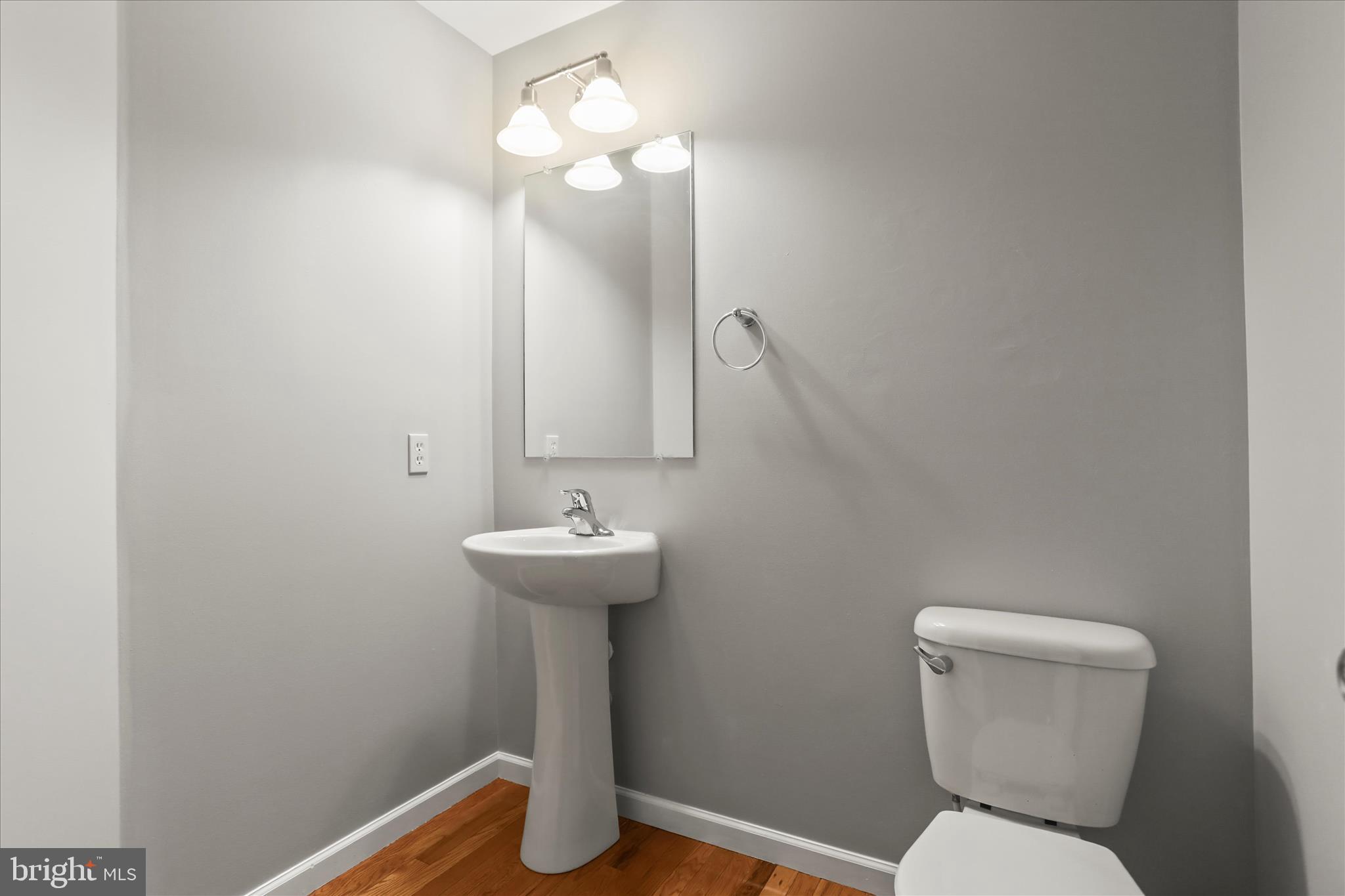 26 South 3rd Street New Freedom, PA 17349 - Photo 17 of 64 a bathroom with a toilet sink and mirror