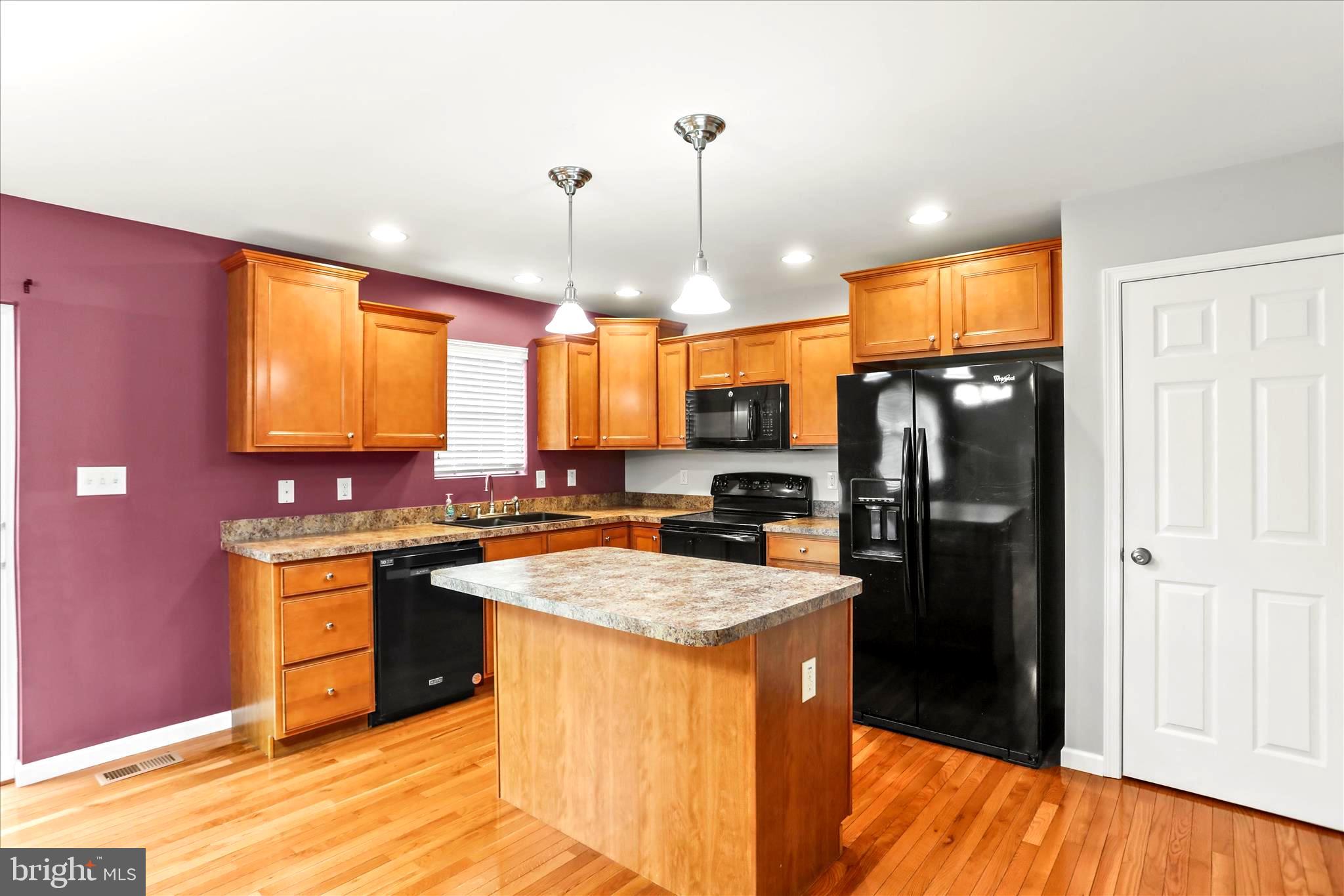 26 South 3rd Street New Freedom, PA 17349 - Photo 24 of 64 a kitchen with stainless steel appliances granite countertop a sink stove and refrigerator