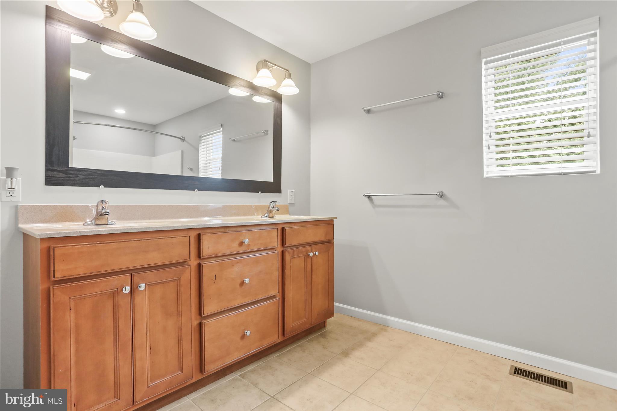 26 South 3rd Street New Freedom, PA 17349 - Photo 38 of 64 a bathroom with a sink vanity and mirror