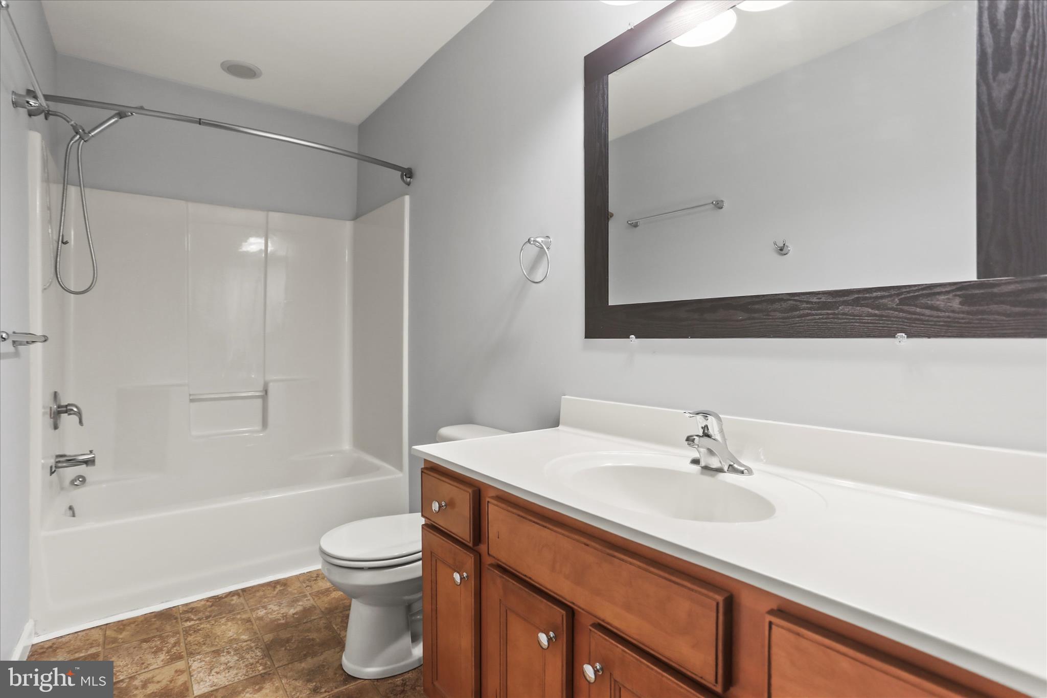 26 South 3rd Street New Freedom, PA 17349 - Photo 42 of 64 a bathroom with a sink a toilet and shower