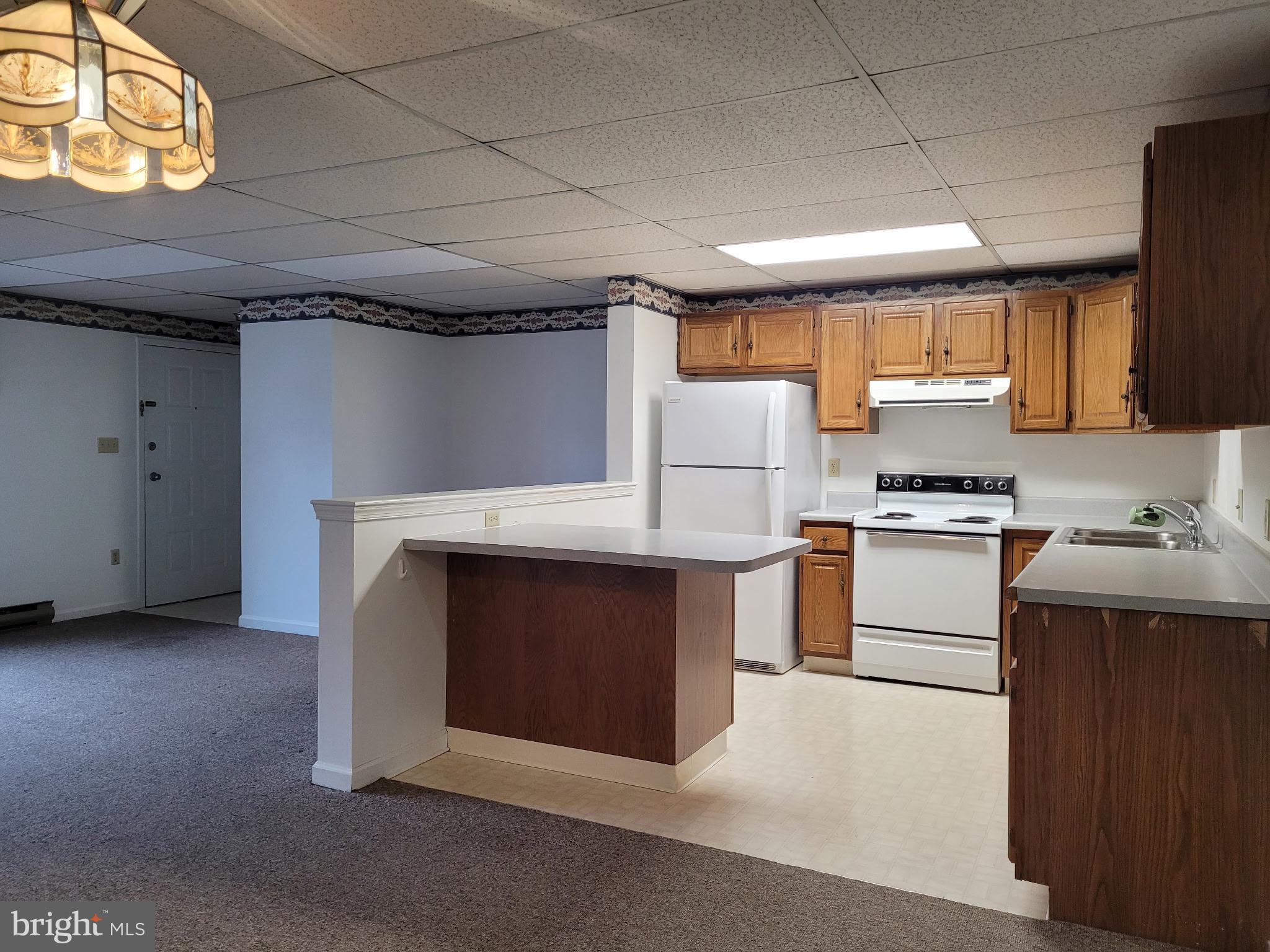 119 Hamilton Avenue Waynesboro, PA 17268 - Photo 4 of 12 a kitchen with a stove and a refrigerator