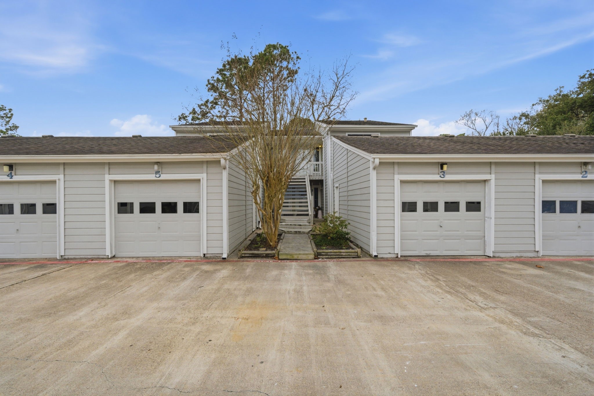 3 Hideaway Drive Friendswood, TX 77546 - Photo 1 of 12 front view of white house with a yard