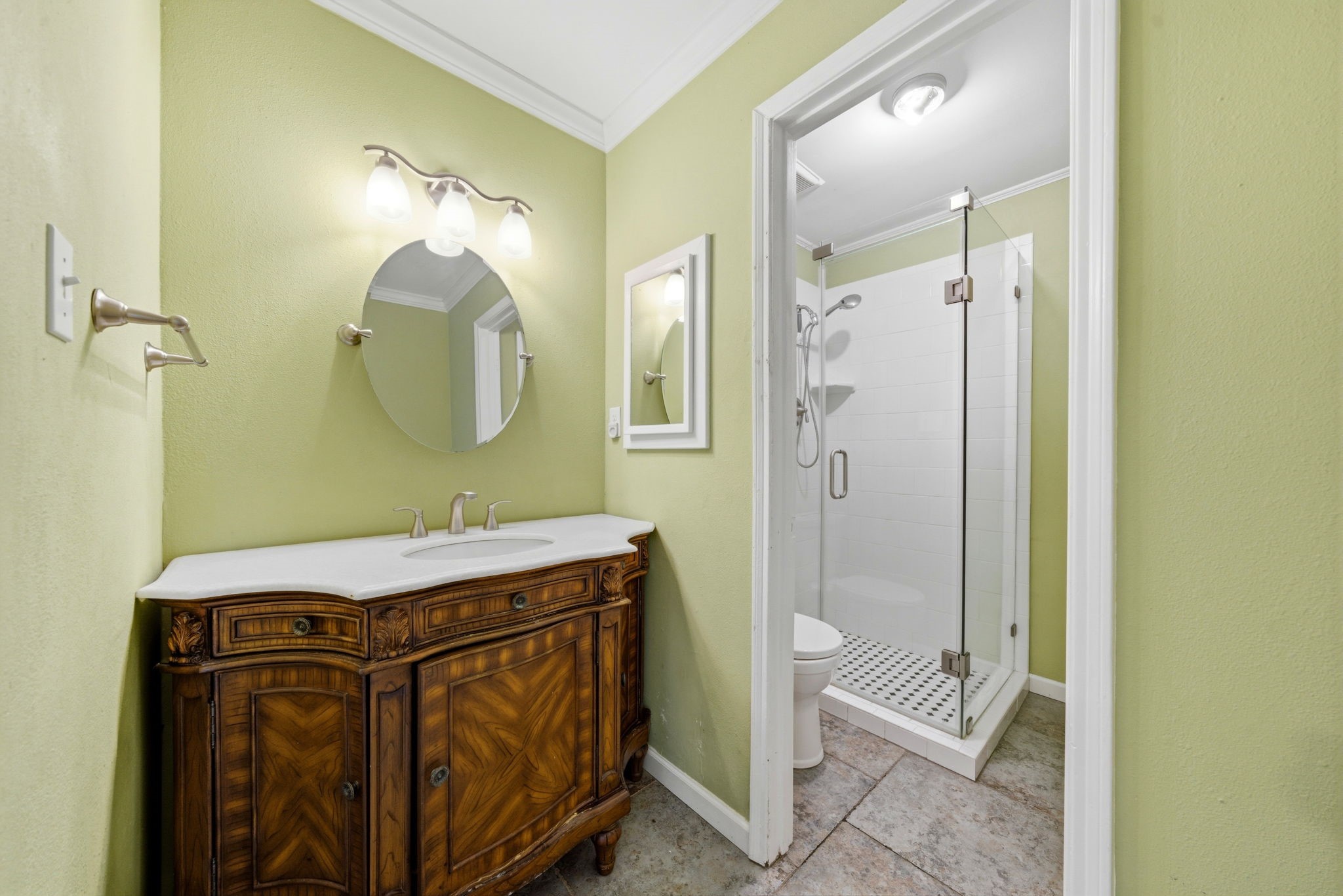 3 Hideaway Drive Friendswood, TX 77546 - Photo 9 of 12 a bathroom with a sink a toilet and shower