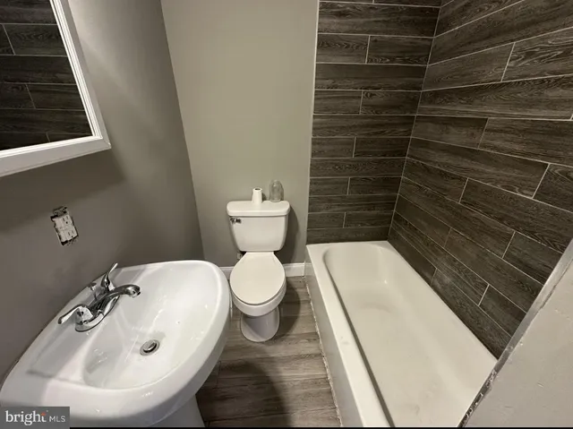 a bathroom with a toilet and a sink
