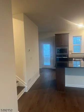 a kitchen that has a sink and a stove