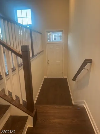 a view of entryway with wooden floor