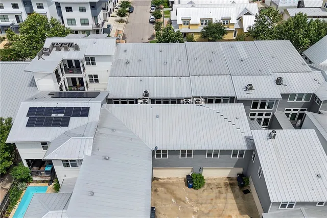 an aerial view of a house with outdoor space