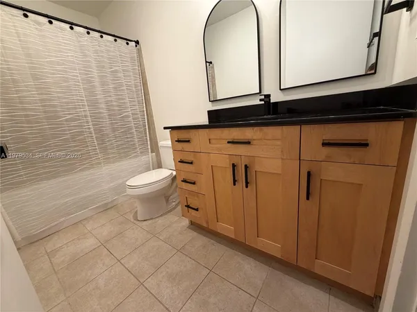 a bedroom with a bed and a table