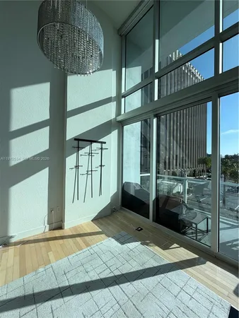 a view of a living room with a flat screen tv