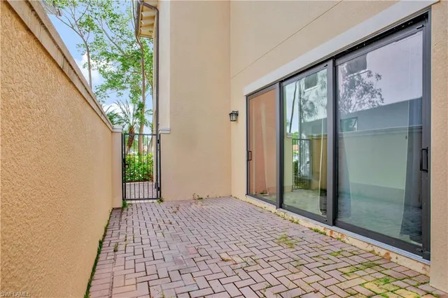 a view of a balcony with wooden floor
