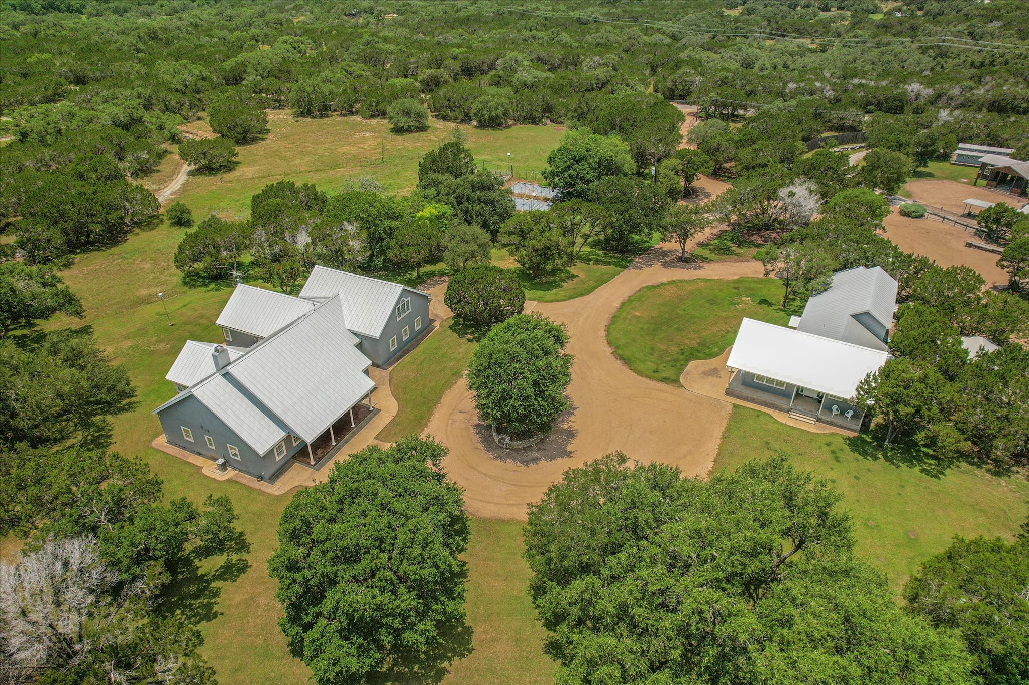 View of main house and guest house joined by circular driveway