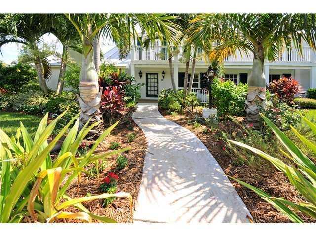 12 Ridgeview Road South Stuart, FL 34996 - Photo 1 of 22 a front view of a house with a yard