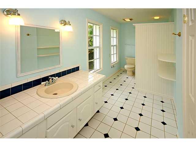 12 Ridgeview Road South Stuart, FL 34996 - Photo 12 of 22 a bathroom with a sink a mirror and a shower