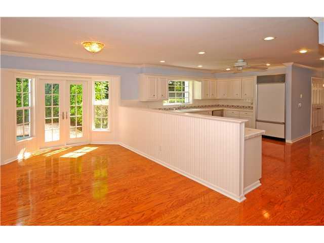 12 Ridgeview Road South Stuart, FL 34996 - Photo 4 of 22 a view of an empty room with wooden floor and a window