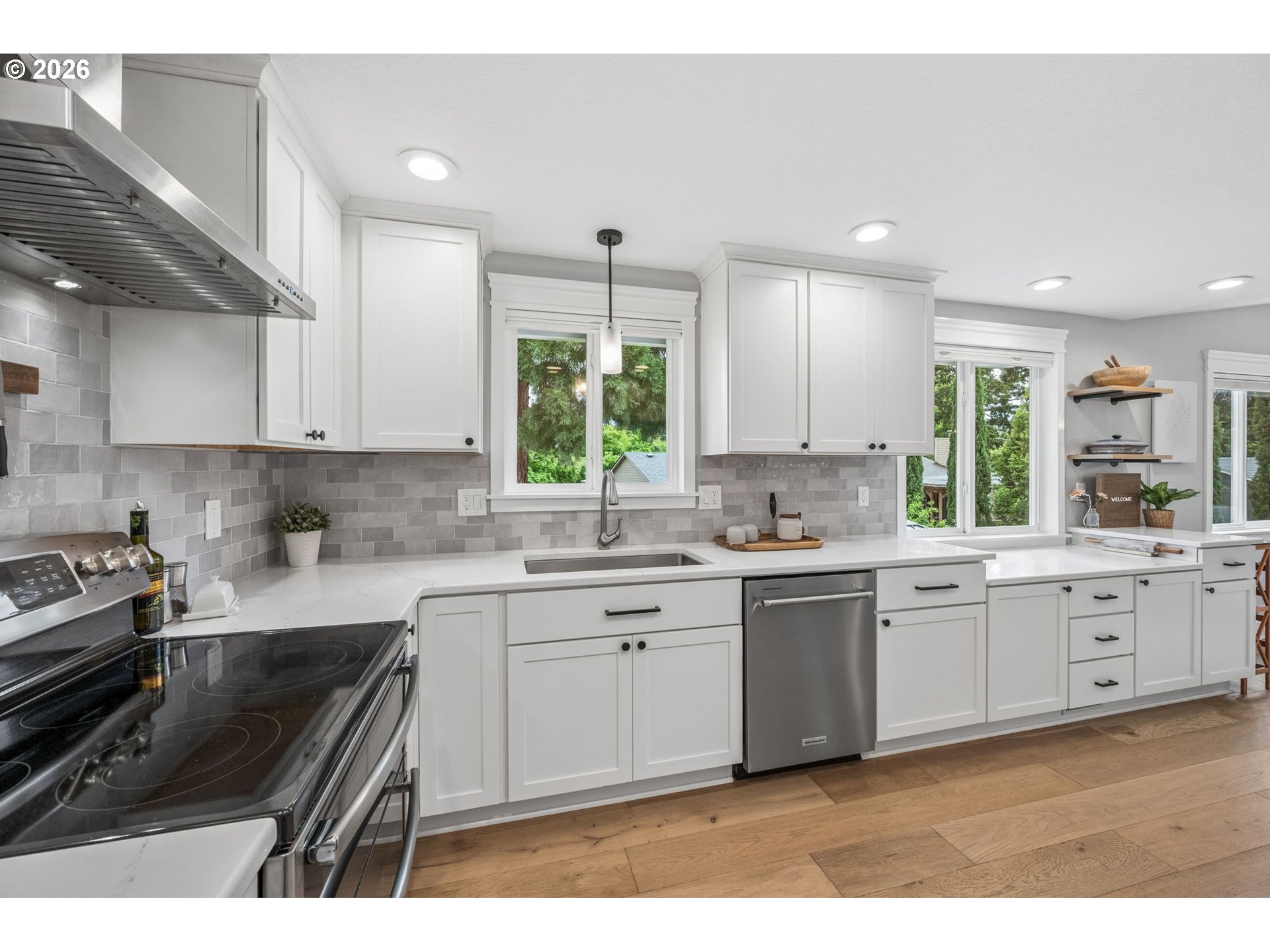 6330 Southwest Fisher Avenue Beaverton, OR 97008 - Photo 14 of 48 a kitchen with a sink stove and cabinets
