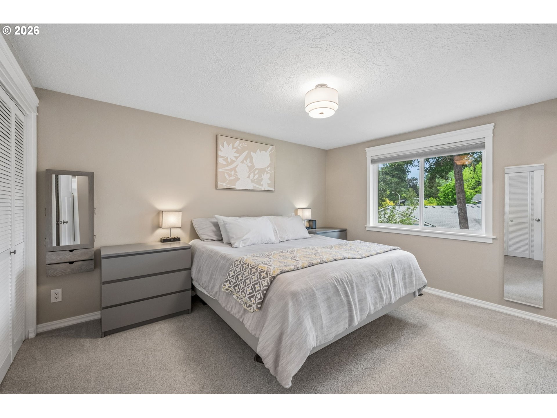 6330 Southwest Fisher Avenue Beaverton, OR 97008 - Photo 16 of 48 a bed room with a bed and a large window