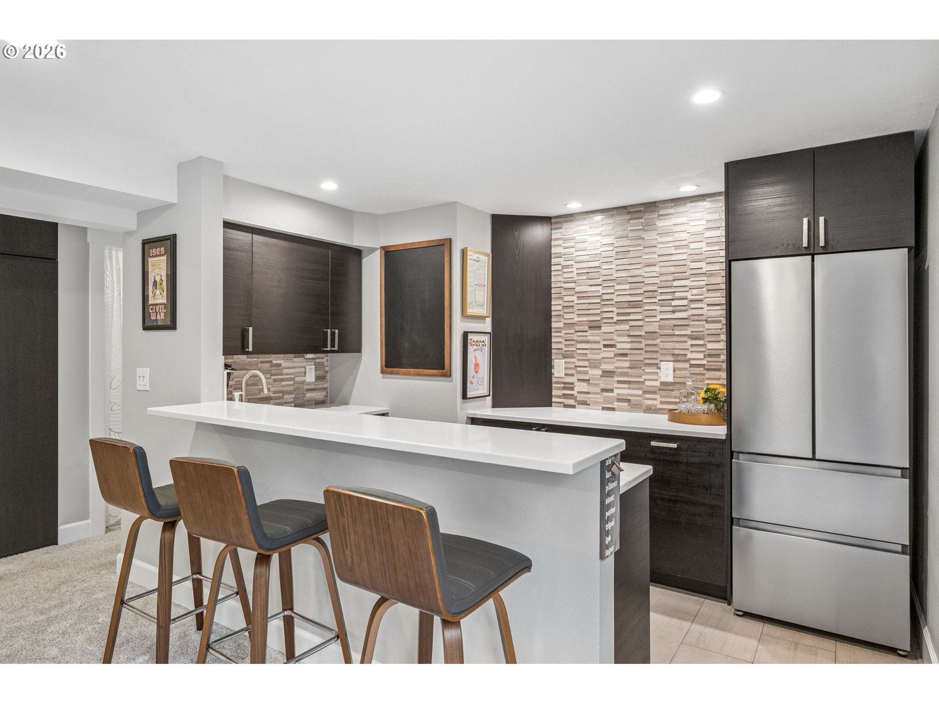 6330 Southwest Fisher Avenue Beaverton, OR 97008 - Photo 27 of 48 a kitchen with stainless steel appliances a refrigerator and a sink
