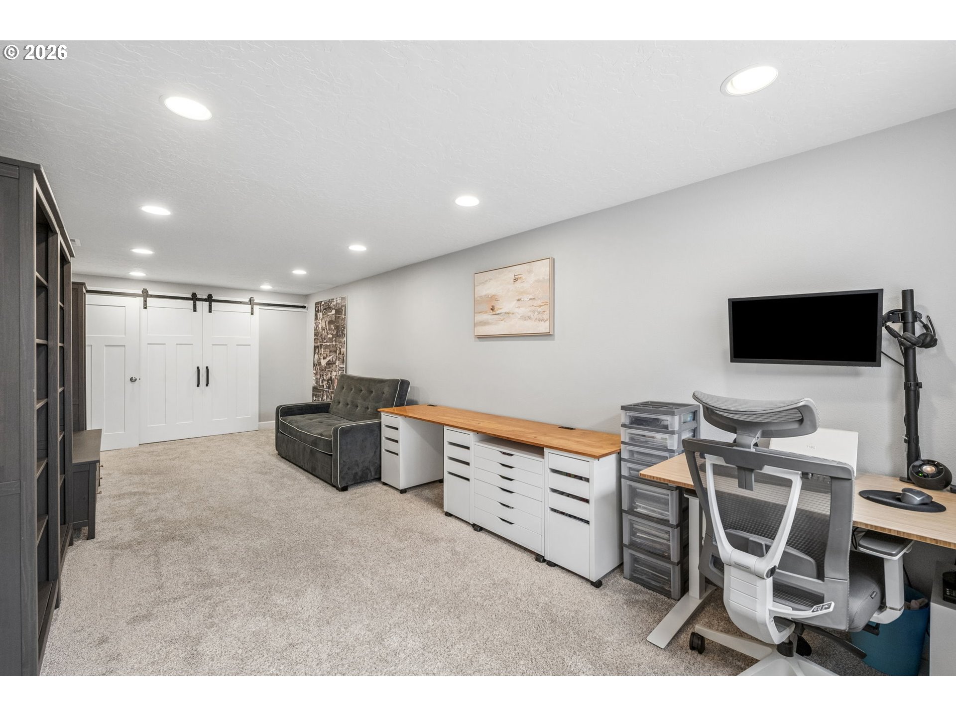 6330 Southwest Fisher Avenue Beaverton, OR 97008 - Photo 33 of 48 a room with furniture a flat screen tv and a table